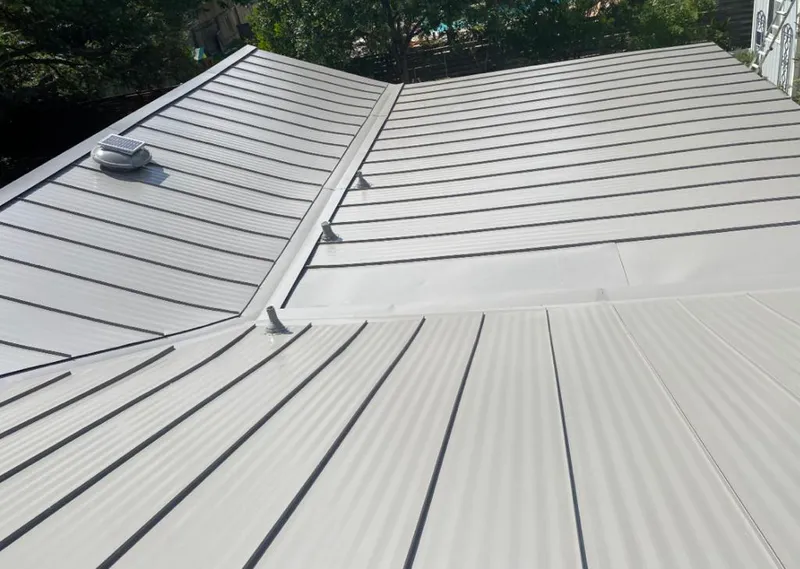 Solar attic fan installed on a metal roof for Roof Ventilation in Pulaski